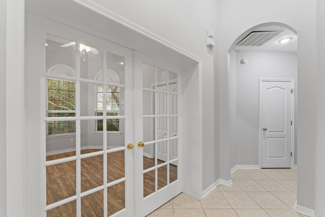 entryway featuring french doors and light hardwood / wood-style floors