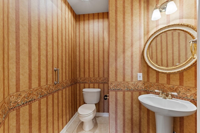 bathroom featuring toilet and tile patterned floors