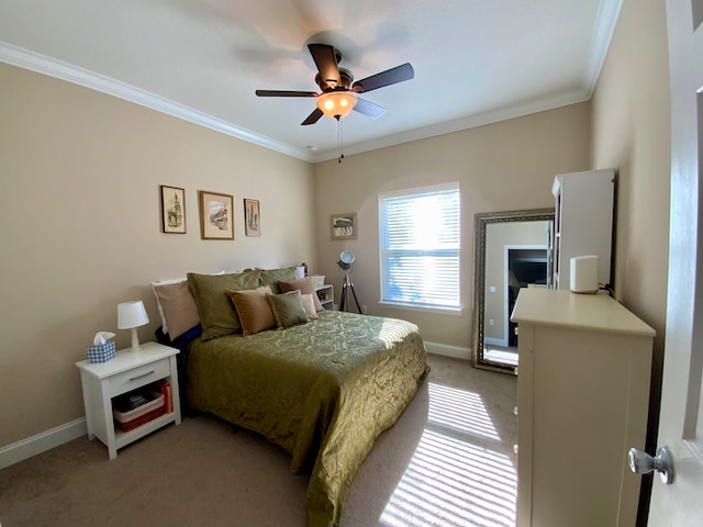 bedroom featuring ceiling fan, carpet floors, and ornamental molding