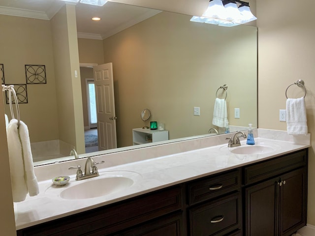 bathroom featuring toilet, vanity, and crown molding