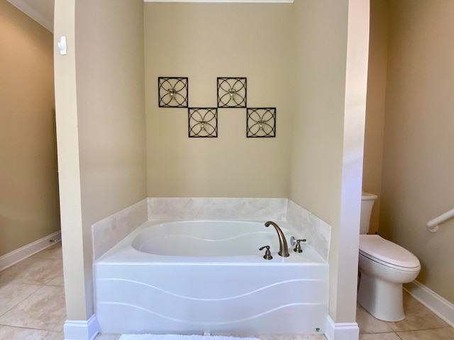 bathroom with toilet, tile patterned flooring, and a bathing tub