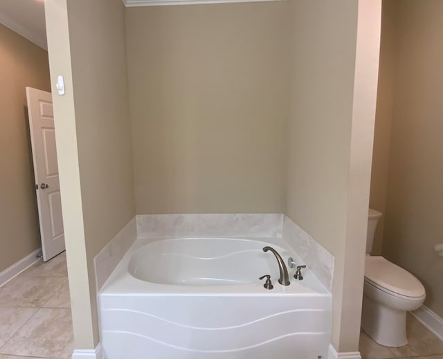 bathroom with a bathing tub, tile patterned floors, toilet, and crown molding