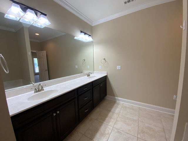 bathroom featuring vanity, tile patterned flooring, and crown molding