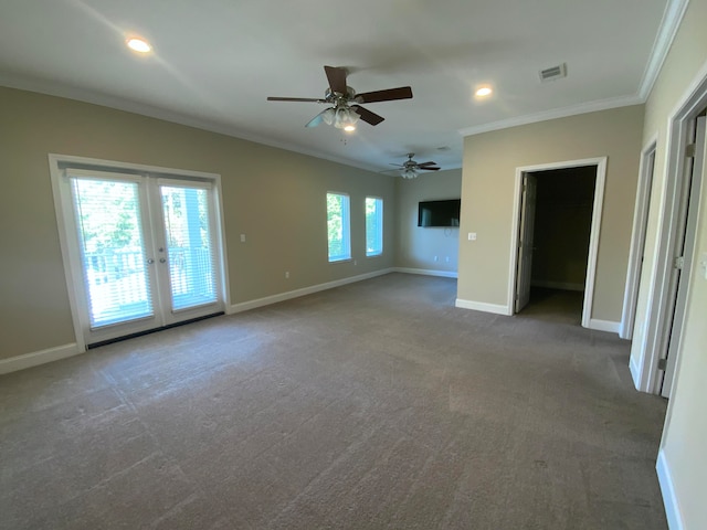 spare room with ceiling fan, french doors, ornamental molding, and carpet floors