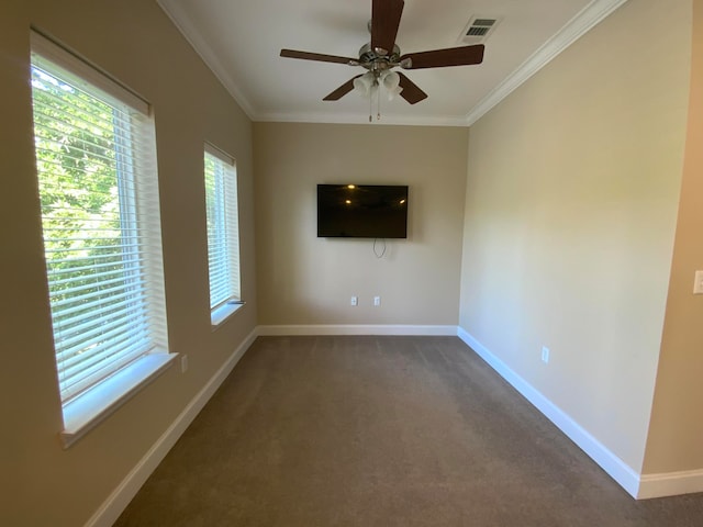 carpeted empty room with ceiling fan and crown molding