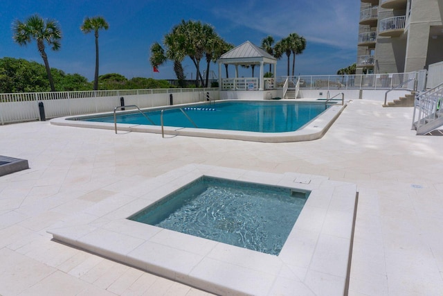 view of swimming pool featuring a gazebo and a patio area