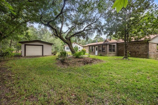 view of yard with an outdoor structure and a garage