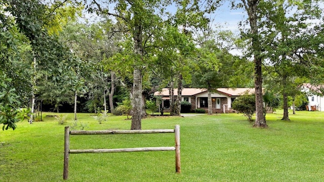 surrounding community featuring a lawn