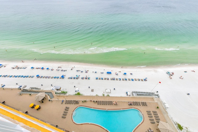 bird's eye view featuring a water view and a view of the beach