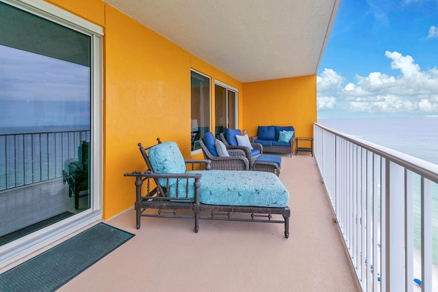 balcony featuring a water view