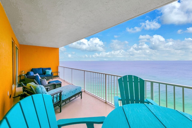 balcony featuring a water view