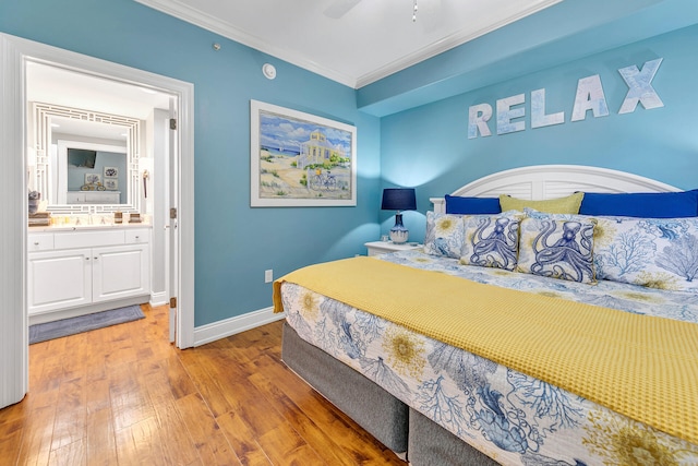 bedroom featuring wood-type flooring, ceiling fan, ornamental molding, and ensuite bath