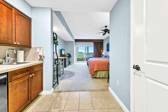 bedroom with light colored carpet and sink