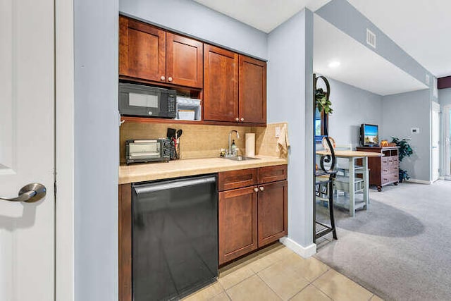 5002 S Sandestin Blvd Unit 6226, Miramar Beach, FL 32550 - kitchen with black microwave, fridge, a sink, light countertops, and backsplash