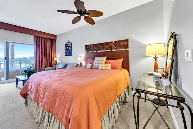 carpeted bedroom featuring vaulted ceiling, ceiling fan, and access to exterior