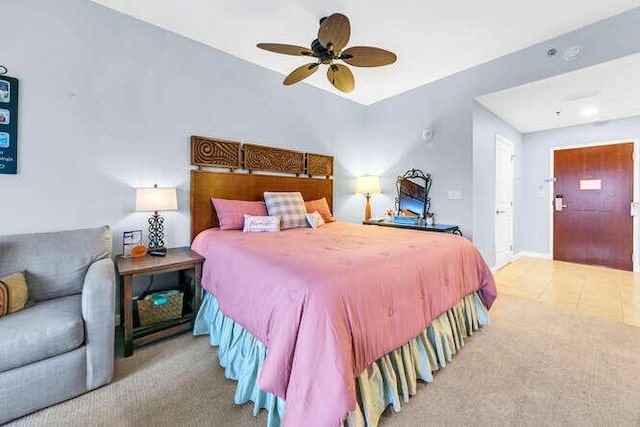 bedroom featuring ceiling fan and light colored carpet