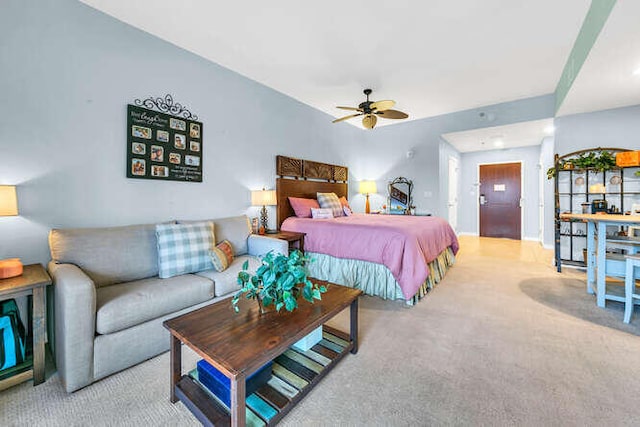 bedroom featuring ceiling fan and light colored carpet