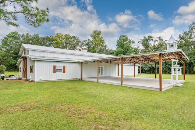 exterior space featuring a yard and a carport