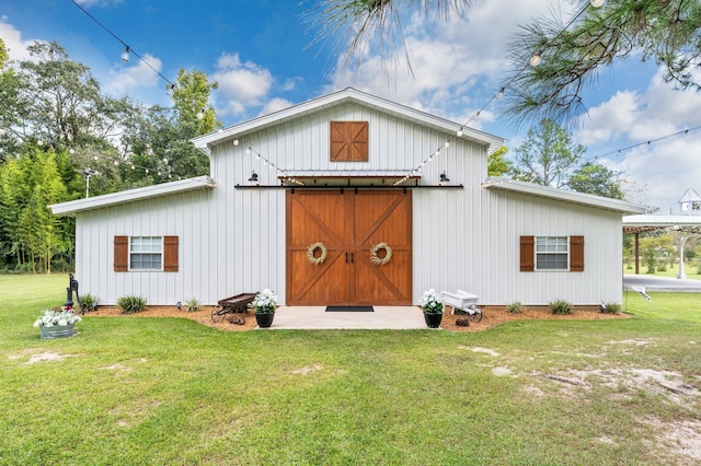 view of outbuilding featuring a lawn