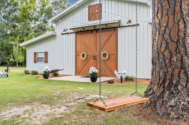 view of outbuilding with a yard