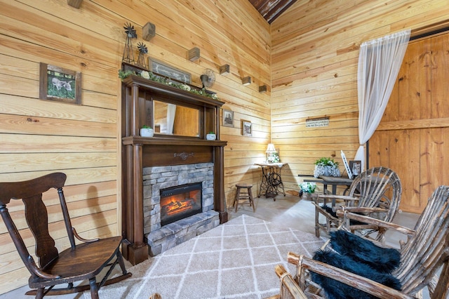 interior space with a fireplace and wooden walls