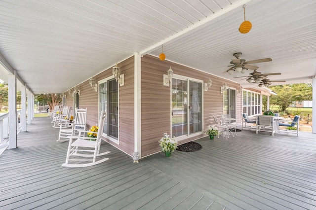 deck with covered porch and ceiling fan