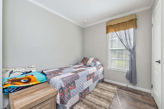 bedroom featuring a textured ceiling, crown molding, and dark hardwood / wood-style floors