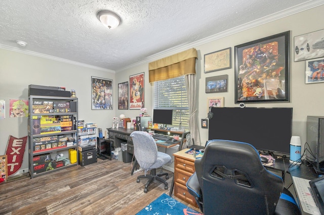 office with ornamental molding, a textured ceiling, and hardwood / wood-style floors