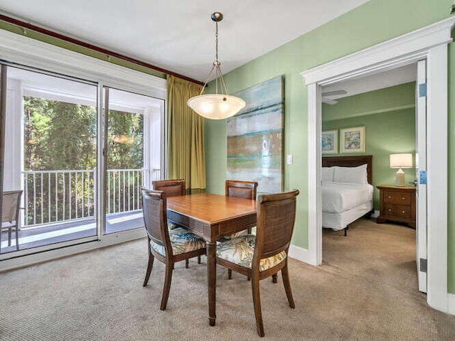 dining area with light colored carpet