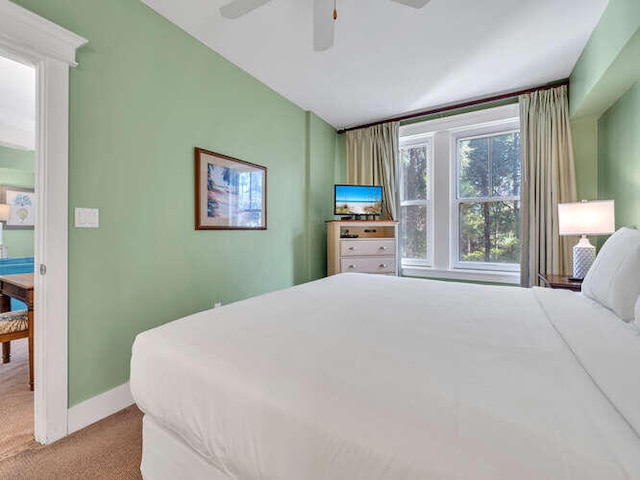 bedroom featuring ceiling fan and light colored carpet