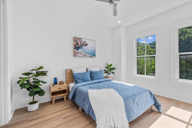 bedroom featuring ceiling fan and light wood-type flooring