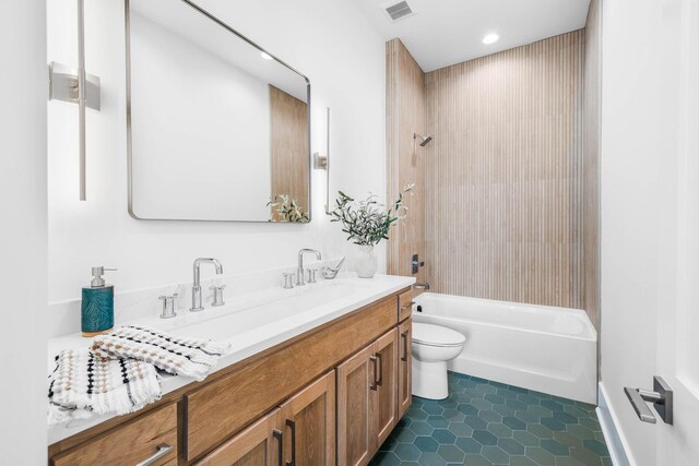 full bathroom featuring bathtub / shower combination, tile patterned floors, vanity, and toilet