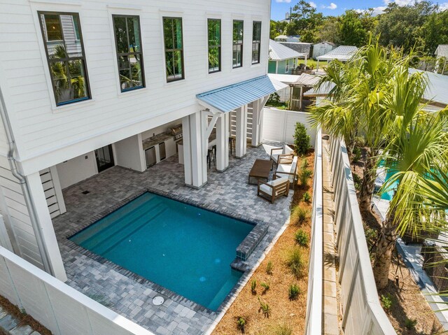 view of swimming pool with a patio area