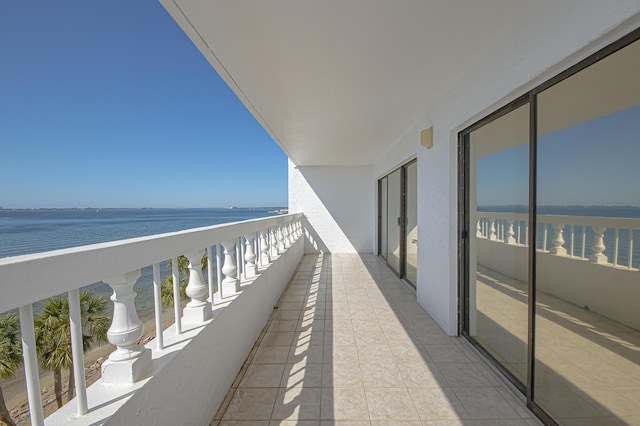 balcony featuring a water view