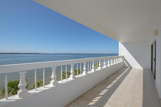 balcony featuring a water view