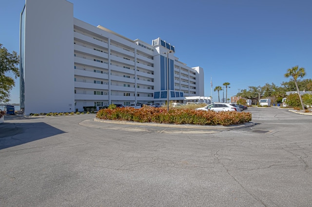 view of property with uncovered parking