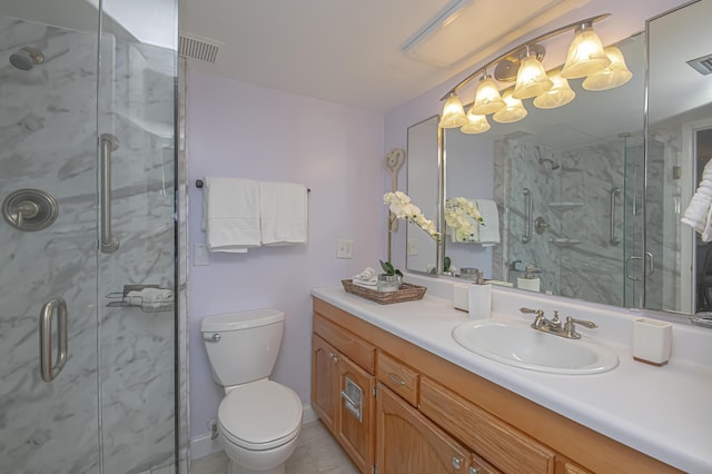 full bath with a marble finish shower, visible vents, toilet, and vanity