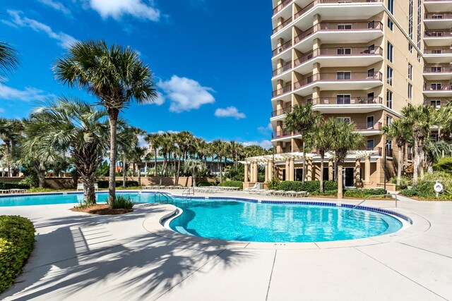 4776 Westwinds Dr Unit 4776, Miramar Beach, FL 32550 - community pool with a pergola and a patio area