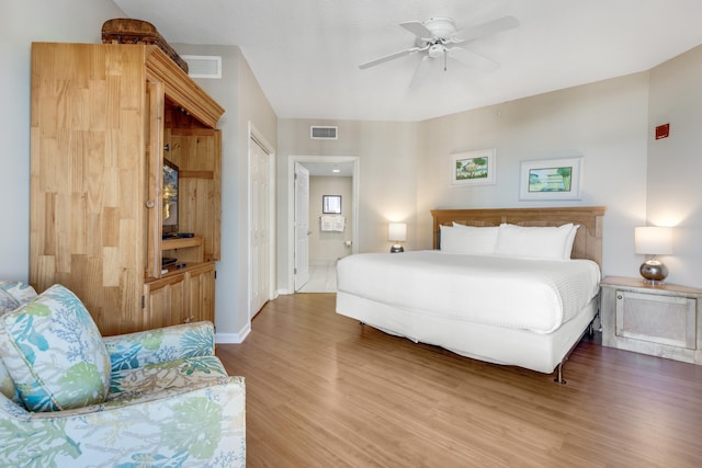 4776 Westwinds Dr Unit 4776, Miramar Beach, FL 32550 - bedroom with wood finished floors, ensuite bathroom, and ceiling fan