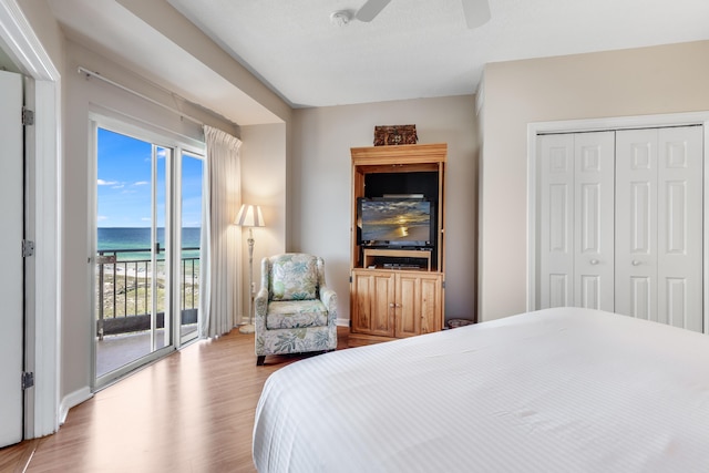 4776 Westwinds Dr Unit 4776, Miramar Beach, FL 32550 - bedroom with access to outside, wood finished floors, a ceiling fan, and a closet