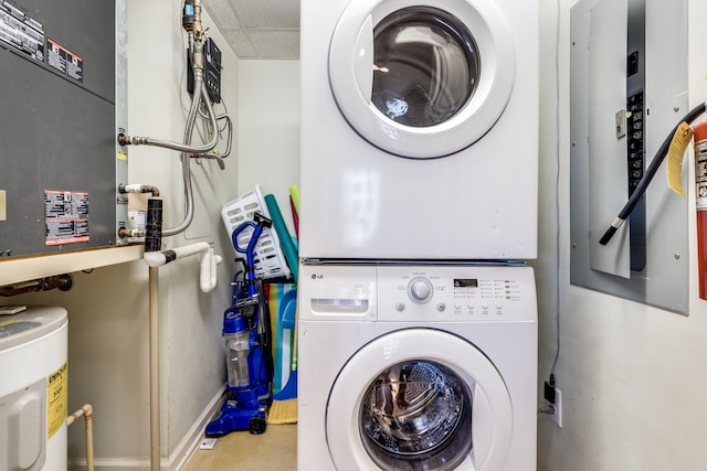 4776 Westwinds Dr Unit 4776, Miramar Beach, FL 32550 - laundry room with stacked washer / dryer and electric water heater