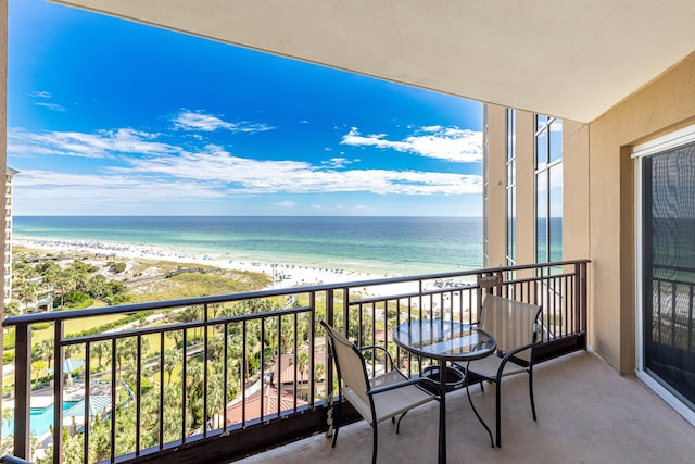 balcony with a view of the beach and a water view