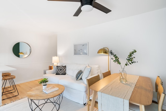 living room with ceiling fan and light hardwood / wood-style floors