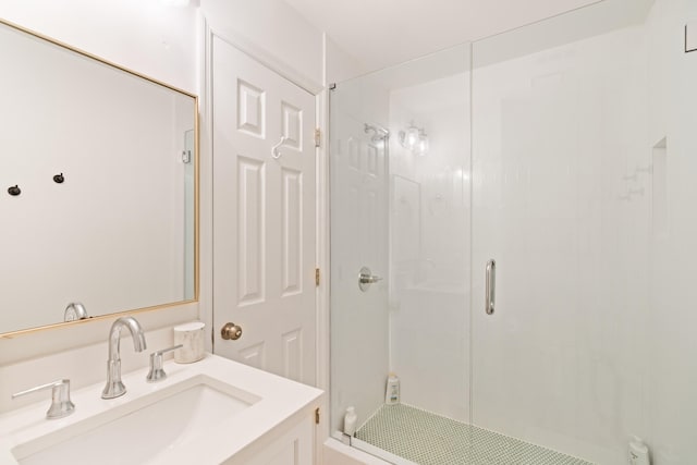 bathroom featuring vanity and an enclosed shower