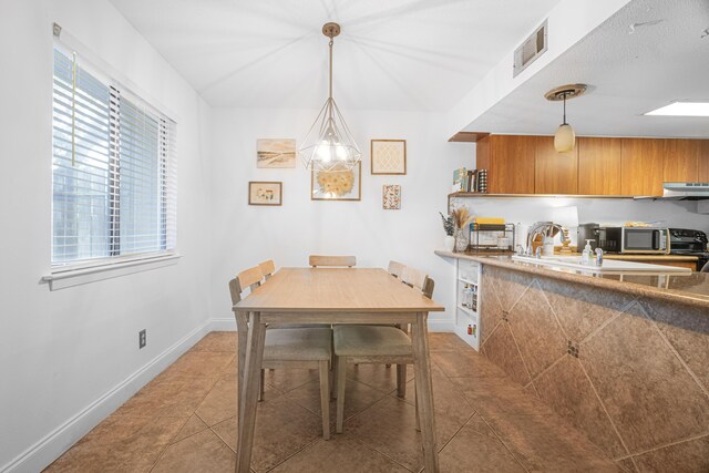 dining room featuring tile patterned flooring