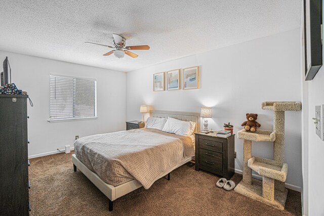 carpeted bedroom with ceiling fan and a textured ceiling