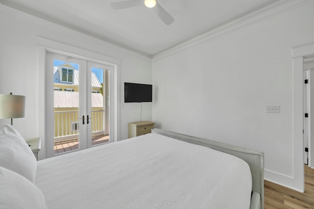 bedroom with french doors, access to exterior, ornamental molding, hardwood / wood-style flooring, and ceiling fan