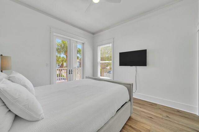 bedroom featuring ceiling fan, ornamental molding, access to exterior, and light hardwood / wood-style flooring