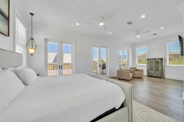 bedroom with wood-type flooring, french doors, access to outside, ornamental molding, and ceiling fan