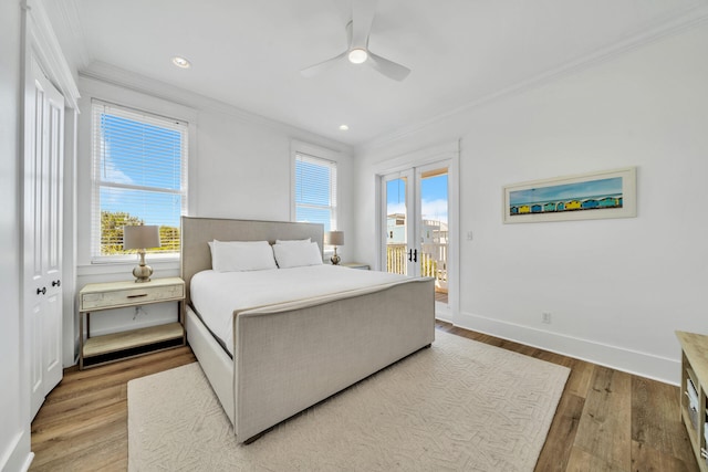 bedroom with light wood-type flooring, a closet, ceiling fan, and crown molding